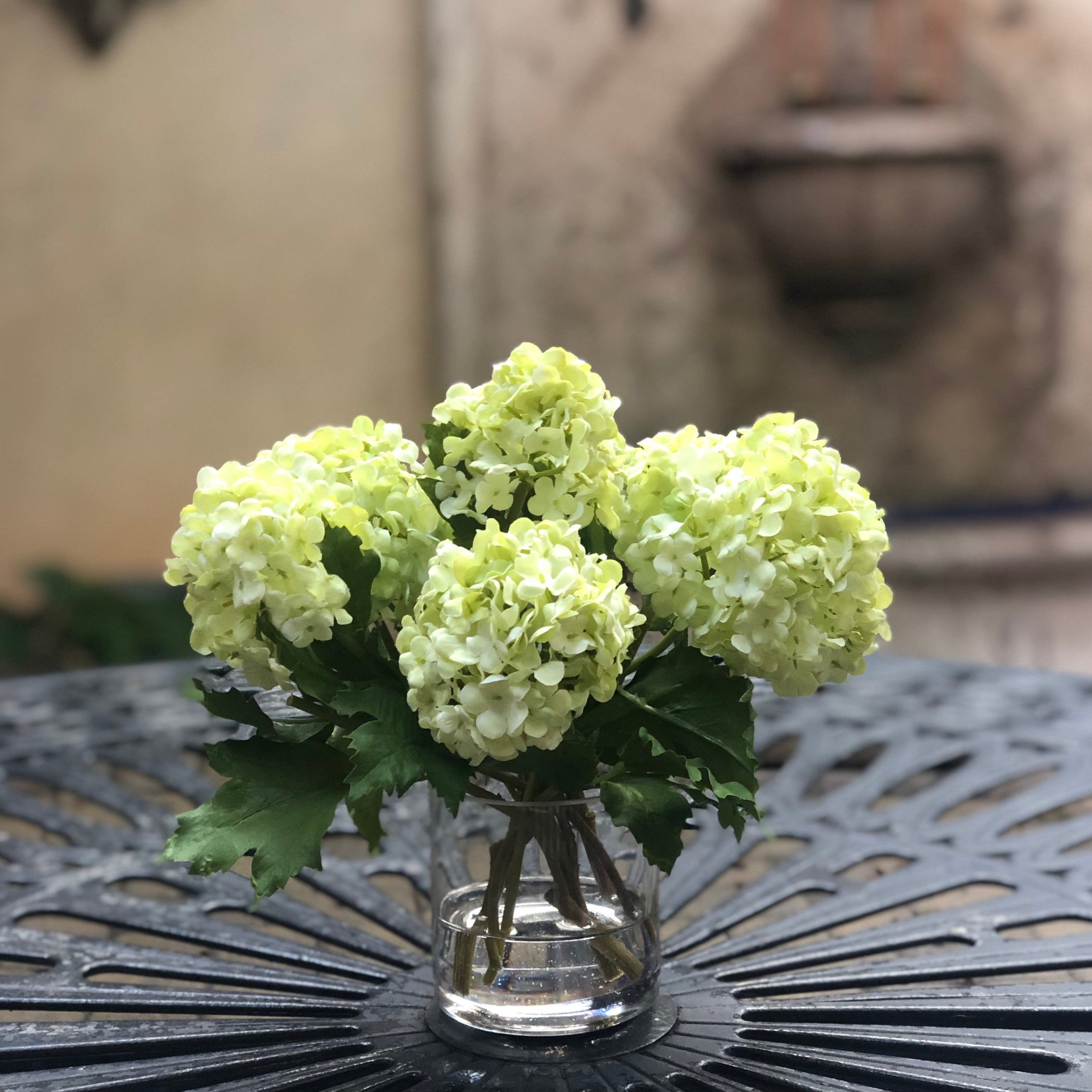 Real touch green hydrangea arrangement in glass vase - 8"